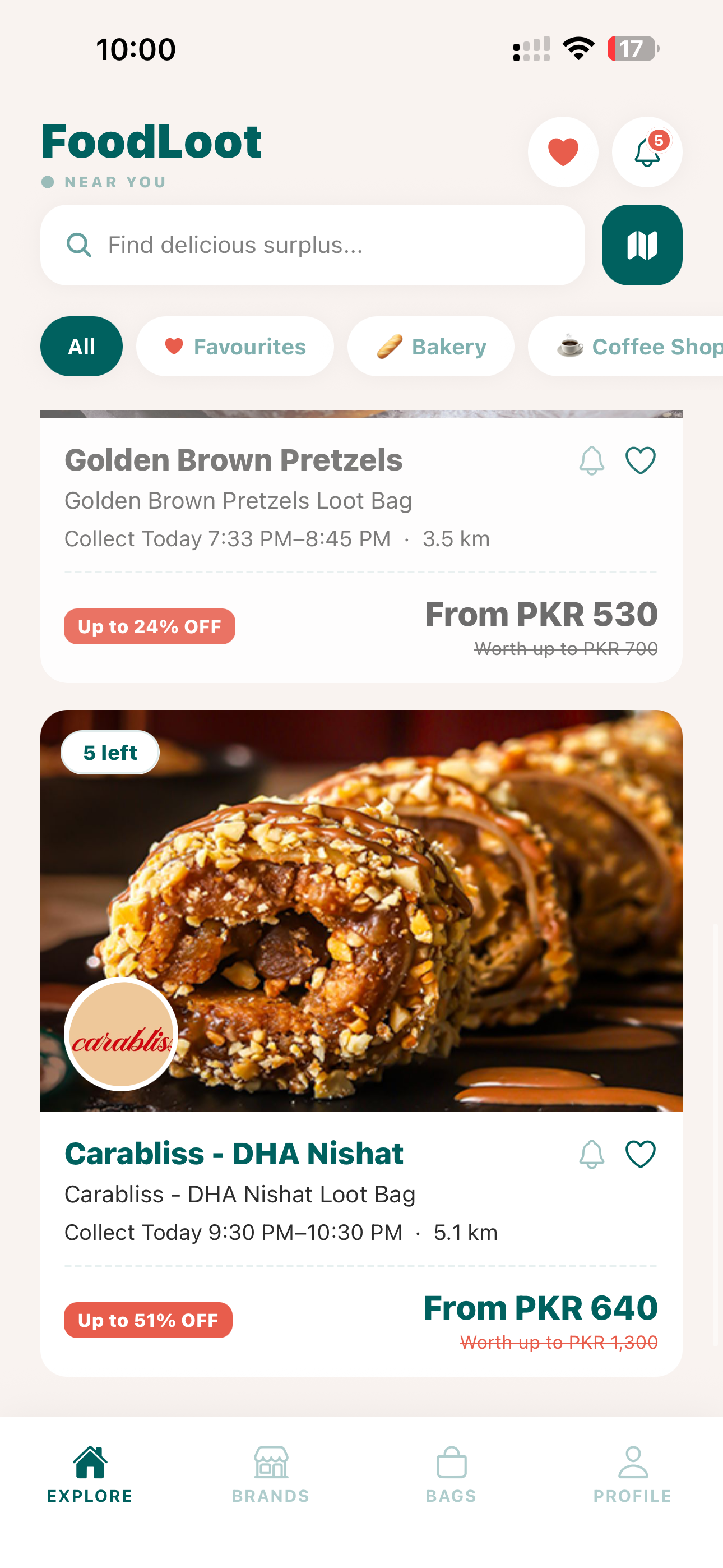 FoodLoot Explore feed showing Golden Brown Pretzels and Carabliss DHA Nishat Loot Bags